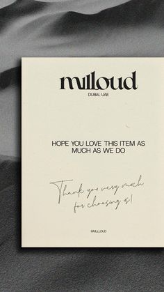 a black and white photo with the words mulquad written in cursive ink