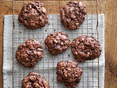 chocolate cookies are cooling on a wire rack