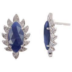 Bold and modern, these marquise stud diamond earrings exude a captivating sophistication. Cast in 18K gold and sterling silver. It is hand set in 3.30 carat blue sapphire and .30 carats of signature diamond pave arches. FOLLOW MEGHNA JEWELS storefront to view the latest collection & exclusive pieces. Meghna Jewels is proudly rated as a Top Seller on 1stDibs with 5 star customer reviews. All items manufactured by us are handmade and can be customized or redesigned. Blue Marquise Earrings For Anniversary, Luxury Marquise Gemstone Earrings, Sterling Silver Marquise Diamond Earrings With Prong Setting, Sterling Silver Marquise Cut Earrings, Marquise Sterling Silver Diamond Earrings, Marquise Diamond Earrings In Sterling Silver, Luxury Marquise Sterling Silver Earrings, Sterling Silver Earrings With Diamond Accents, Marquise Cut, Blue Sapphire Diamond