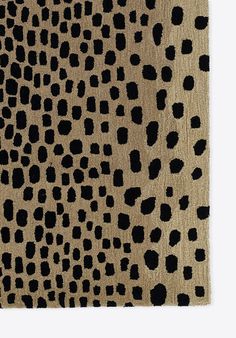 an animal print rug with black spots on it