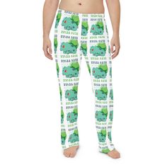 Made with 100% brushed polyester, these customized pajama pants add luxurious comfort and style to everyday life. The soft and stretchy fabric has the perfect balance of coziness and agility for maximum relaxation when lounging at home.  .: Material: 100% brushed polyester .: Light fabric (5.6 oz/yd² (190 g/m .: Elastic waistband .: Printed-in size and care label .: Assembled in the USA from globally sourced parts .: Seam thread color automatically matched to design (black or white) Some of designs made with a.i. Playful Loungewear Bottoms With Cartoon Print, Grinch Mens Pajama Pants, Playful Character Print Loungewear Bottoms, Playful Green Cartoon Print Sleepwear, Playful Cotton Sleepwear Pajama Pants, Mens Pajama Pants, Sleep Shorts, Pajama Robe, Mens Pajamas