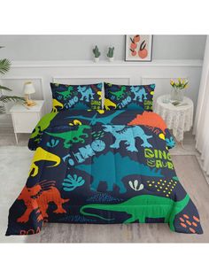 a bed with dinosaurs on it in a room