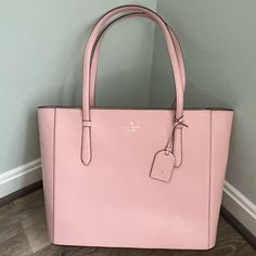 Dusty Pink Kate Spade Tote. Top Zip Closure; Interior Multifunction Pockets; Inside Zippered Pocket; Two Way Spade Jaquard Lining. Straps With 10” Handle Drop. 14”W X 11”H X 6”D Kate Spade Designer, Pink Kate Spade, Vinyl Bag, Bags Pink, Kate Spade Totes, Kate Spade Tote Bag, Nylon Tote Bags, Large Leather Tote, Satchel Tote