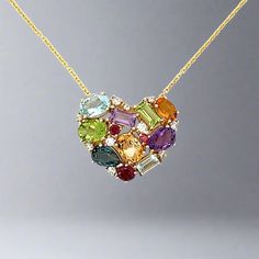 Fall in love with our multicolor gemstone heart necklace! Featuring beautiful amethyst, London blue topaz, citrine, Madera citrine, sky blue topaz, rhodolite, diamond, and peridot stones, it's sure to make a statement and bring you joy. A perfect gift for a loved one, or just for yourself! Jewelry Style : Pendant w/ Chain Metal Type : 14K Yellow Gold Brand : Effy Multi Stone Weight : 6.95 ctw Diamond Weight : 0.28 ct Color : H-I Clarity : SI2-I1 Dimension : 1.0" x 0.5" Multicolor Heart-shaped Birthstone Jewelry, Artisan Multicolor Heart-shaped Jewelry, Heart-shaped Ruby Gemstone Necklace, Multicolor Heart-shaped Gemstone Necklace, Heart-shaped Crystal Gemstone Necklaces For Valentine's Day, Peridot Stone, Jewelry Style, Gold Branding, Heart Gemstone