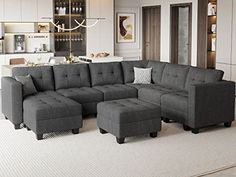 a large gray sectional couch in a living room