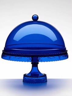 a blue cake dish on a white table