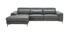 a gray leather sectional sofa sitting on top of a white floor