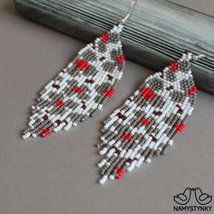 These floral beaded earrings are made of high-quality Czech beads and strong synthetic thread. They are elegant, fashionable, and highly versatile, suitable for everyday wear. Features: Sterling silver components Color: white, gray, red, brown Length (approximate): 9,5 cm (3.74 in) This item is currently in stock. You must be completely satisfied. If you find merchandise unsatisfactory for any reason, return it within 10 days and your money will be refunded without questions. More beaded earring Handmade Gray Beaded Earrings For Gift, White Silver Beaded Drop Earrings, White Earrings With Silver Beads For Gift, Handmade Gray Beaded Dangle Earrings, Blue Beaded Earrings, Beaded Earrings Native, Native American Earrings, Beaded Earring, Indian Earrings