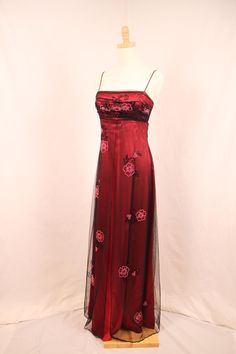 Vintage 1990s Y2K formal maxi dress, black mesh overlay with floral beading zip and hook closure and adjustable corset tie at back black and red  Label: Morgan and Co. Material: 100% polyester Best fits: Small, tag size 5/6 Condition: excellent vintage condition Measurements (laid flat)  - bust: 15"  waist: 14"  straps: 14"  bust to hem: 48" Cherry Prom Dress, Y2k Formal, Formal Maxi Dress, Embellished Maxi Dress, Red Label, Maxi Dress Formal, Mesh Overlay, Formal Gowns