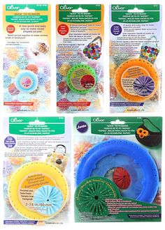 four different types of frisbees in plastic packaging