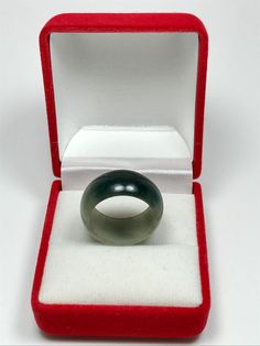 This jadeite ring band outer is rounded and and flatten on the inside by hand. This jade band is untreated Type-A jadeite jade. It has been polished on the inside and outside. The photos have not been altered or changed at all. *Ring Band Shape: Flat Inner, Round Outer *Color: Icy Deep Apple Green Moss-In-Snow *Luster: Vitreous *Transparency: Translucent *Inside Width: 7 3/4 US *Width: 10.5mm *Size: Medium *Texture: Fine and No Flaws *Free standard shipping from Thailand *Comes with a beautiful Adjustable Jade Ring, Formal Adjustable Emerald Ring, Adjustable Formal Emerald Ring, Vintage Round Jade Rings, Adjustable Emerald Ring For Formal Occasions, Classic Green Crystal Ring, Jadeite Ring, Jade Bangle, Jade Ring