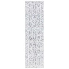 a white runner rug with an intricate design