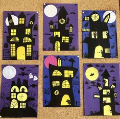 four pieces of paper cut out to look like houses with bats and pumpkins on them