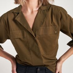 The Fay Boyfriend Shirt is roomy and relaxed but decidedly feminine and sophisticated. Crafted from cotton lawn, a lightweight yet durable fine thread poplin, the Faye has a silky-smooth hand feel. Its unique features include a lay-flat camp collar with an elevated top button and loop closure, wide-set pleated center front placket, and exquisite topstitching details on the sleeve placket and cuff. 100% Cotton Button flap patch pockets at the chest High side-slits at the hem for a fashionable tuc Collared Cotton Camp Shirt, Cotton Collared Camp Shirt, Relaxed Fit Shirt With Roll-up Sleeves And Camp Collar, Workwear Shirt With Rolled Sleeves And Camp Collar, Effortless Work Shirt With Pockets, Effortless Workwear Shirt With Pockets, Effortless Workwear Blouse With Pockets, Spring Long Sleeve Camp Shirt With Pockets, Daywear Blouse With Camp Collar