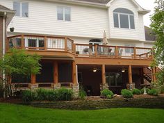 a large white house with two story decks