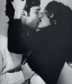 black and white photograph of two people kissing