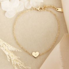 Tiny Heart Cross Bracelet * This listing is for one (1) bracelet * Lengths: 6.5" + 1.5" extender. Lengthens up to 8" * Measurements: 7mm charm * Chain: Delicate simple chain * Finish: 18K gold over surgical or polished surgical steel. Tarnish resistant and waterproof. * Nickel Free and Lead Free. Hypoallergenic. * All our jewelry is packaged in signature LoveStory Collection by MAIVE gift boxes. If you would like multiple items from your order packaged separately please let us know! Please message us if you have any questions about our products, styling, or recommendations. We are happy to help! © 2024 LoveStory Collection by MAIVE Adjustable Dainty Chain Bracelet With Heart Charm, Delicate Personalized Heart Bracelet As A Gift, Dainty Bracelets With Adjustable Chain For Valentine's Day, Dainty Adjustable Charm Bracelet For Valentine's Day, Adjustable Heart-shaped Delicate Chain Bracelet, Dainty Adjustable Chain Bracelet For Valentine's Day, Dainty Adjustable Bracelet With Heart Pendant, Dainty Heart Bracelet With Adjustable Chain For Wedding, Adjustable Delicate Heart Chain Bracelet