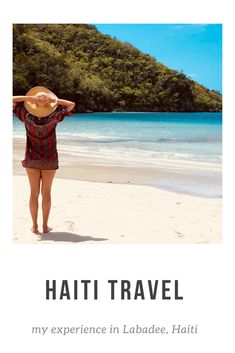 a woman standing on top of a beach next to the ocean with her hands behind her head