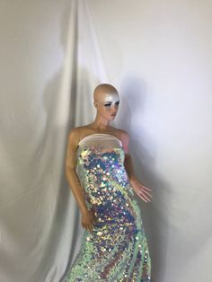 a mannequin wearing a dress with sequins on it