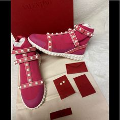 Brand New With The Box, Dustbag, Extra Studs Authentic Valentino Studded Sneaker High Top Pink Some Wear And Fading On The Box Pyramid Studded Cage Straps Round Toe Stretch Knit Construction With Overlay Trims Hook & Loop Vamp & Ankle Straps Foam Midsole Textured Grip Sole Made In Italy Textile Upper; Manmade Sole First Purchase On Poshmark? Sign Up & Use Invite Code: Gdhogan At Checkout For $10 Off Your Purchase! Studded Sneakers, Valentino Shoes, Valentino Studs, Ankle Straps, Pyramid, Bright Pink, Womens Shoes Sneakers, High Top, High Top Sneakers