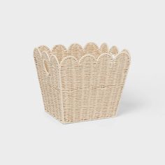 a wicker basket with scalloped edges