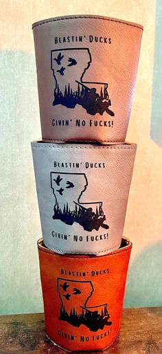 three buckets are stacked on top of each other