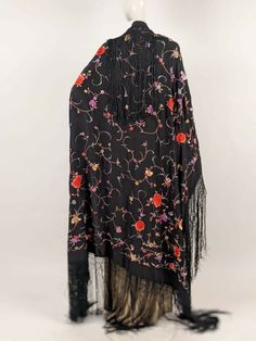 BEAUTIFUL ANTIQUE HAND EMBROIDERED CANTON SHAWL W FLORALS & LONG FRINGE DATING TO THE VICTORIAN TURN OF THE CENTURY FASHIONED OF A BLACK SILK IN POLYCHROME SILK FLOSS EMBROIDERY IN BEAUTIFUL FLORAL PATTERNS THE EDGES HAVE HAND KNOT FRINGE.  CONDITION:  NO FLAWS FOUND.  A VERY BEAUTIFUL ANTIQUE CANTON SHAWL THAT IS STRONG AND WEARABLE.  SIZING: MEASUREMENTS IN INCHES:  52 INCHES SQUARE NOT INCLUDING THE FRINGE FRINGE MEASURES 18 INCHES   our business name is ANTIQUE WARDROBE . We can be found onl Silk Shawl With Intricate Embroidery, Bohemian Shawl With Floral Embroidery, Silk Floral Print Shawl, Traditional Fringed Shawl Scarf, Traditional Fringe Shawl Scarf, Traditional Shawl Scarf With Fringe, Antique Wardrobe, Long Fringes, Black Silk