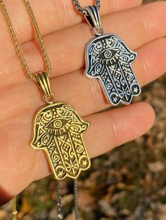 "Beautifully Hand crafted Hamsa pendants **IF YOU WANT A PENDANT ONLY AND NO CHAIN, PLEASE SELECT \"0\" CHAIN LENGTH** Solid 925 sterling silver! Unique custom made one of a kind! We have 2 styles! Rhodium finished & 14k yellow gold finished! Gold is vermeil bonded to solid silver underneath so color wont fade or tarnish Both are oxidized (blackened to give a more vintage look) Pendant measures roughly 1.25\" by 1.25\" (1.75\" w. bale)...weighs roughly 10.5 grams! 100% 925 silver...not plate Silver 14k Gold Charm Necklace Tarnish Resistant, Silver Brass Jewelry With Lobster Clasp, Symbolic White Gold Stainless Steel Jewelry, Good Luck Sterling Silver Tarnish-resistant Jewelry, Symbolic Tarnish Resistant Stainless Steel Necklaces, Spiritual Silver Charm Necklace As Gift, Tarnish-resistant Sterling Silver Good Luck Jewelry, Spiritual White Gold Jewelry Tarnish Resistant, Symbolic Tarnish Resistant Stainless Steel Necklace