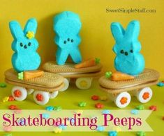 three blue peeps are riding on skateboards with carrots in the shape of bunnies