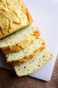 sliced loaf of bread sitting on top of a cutting board