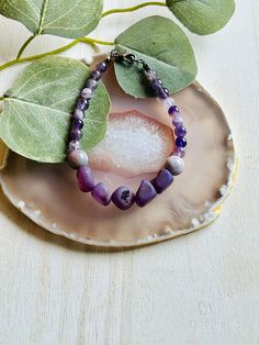 "The adorable amethyst beaded bracelet. Made in the USA. Made with a beaded chain and lobster claw clasp. This bracelet is the perfect accessory for any womens wardrobe.  This bracelet is a great womens gift.  The bracelet is a length of 8\" *Do to it being natural material slight variations in size, color, and patterns are to be expected. No two will be the same." Lavender Beaded Bracelets With Natural Stones For Gift, Lavender Beaded Bracelets With Natural Stones, Lavender Gemstone Beaded Bracelets As Gift, Purple Beaded Bracelet Jewelry, Lavender Beaded Bracelet Jewelry, Adjustable Amethyst Jewelry With Lobster Clasp, Adjustable Beaded Amethyst Bracelets, Adjustable Lavender Bracelets With Natural Stones, Adjustable Lavender Bracelet With Gemstone Beads