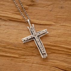 Share the spirit of faith with someone you hold dear. This sterling silver double cross necklace is a fitting gift for anyone on your gift list. It features two sterling silver crosses that have been hand-designed and melded together in a harmony of design. Suspended from a sterling silver chain or a leather cord with silver clasp and endings. It makes a gorgeous accessory that can be worn every day or reserved for those special occasions. It provides you with the unique opportunity to accessori Sterling Silver Cross Pendant Necklace For Wedding, Sterling Silver Cross Necklace For Wedding, Sterling Silver Cross Pendant Necklace For Anniversary, Silver Cross Necklaces For Wedding, Silver Engraved Cross Necklace For Anniversary, Silver Crucifix Cross Necklace For Anniversary, Spiritual Crucifix Cross Necklace For Anniversary, Engraved Silver Cross Necklace For Anniversary, Engraved Cross Necklace For Anniversary