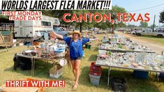 a woman standing in front of a table filled with dishes and other items that are on sale