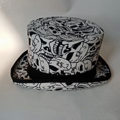 Elevate your accessory game with theWool Felt Skull Print Hat, a blend of presidential elegance and modern edge. This adult hat, featuring a striking white skull print, is perfect for making a bold statement at any event. Crafted from high-quality wool felt, this versatile hat is ideal for magic shows, equestrian events, or as a standout piece in your everyday wardrobe. Key Features: Premium Wool Felt: Made from 100% wool felt, offering a soft, durable, and comfortable fit for all-day wear. Striking Skull Print: The white skull print design adds a unique, edgy twist to the classic felt hat. Versatile Styles: Perfect for equestrian events, magic shows, or as a stylish addition to any formal or casual outfit. Presidential Equestrian Influence: The design takes inspiration from presidential h Adjustable Skull Print Hats For Halloween, Adjustable Skull Print Halloween Hats, White Halloween Cap, White Adjustable Top Hat, White Adjustable Halloween Costume Hats And Headpieces, Adjustable White Halloween Costume Hat, White Fitted Top Hat With Flat Brim, Halloween Skull Hat, One Size Fits Most, One Size Fits Most Skull Hat For Halloween