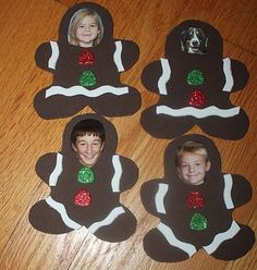 four gingerbread cookies decorated to look like the faces of two people and a dog