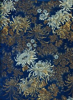 blue and gold fabric with flowers on it