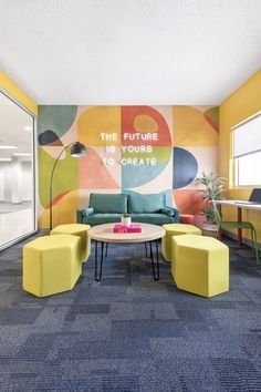 an office with yellow and blue furniture