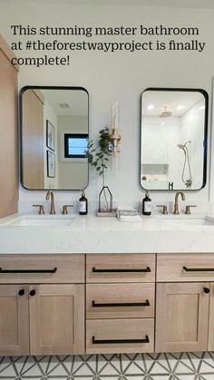 a bathroom with double sinks and two mirrors on the wall next to eachother