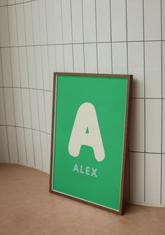 a green and white sign with the word alex on it