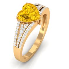 a yellow heart shaped diamond ring with diamonds around it