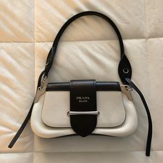 Authentic Prada Black And White Leather Only Used 2-3 Times Comes With 2 Straps - Short Strap And Longer Strap ***Please Note There Are Stains From The Front Flap That Shuts The Purse. See Photos *** Black Outfit White Bag, Black And White Purse Outfit, White Designer Bag Outfit, Black And White Bag Outfit, White Luxury Bag, Prada Bags Aesthetic, White Designer Bag, Cute Prada Bags, Prada Purse