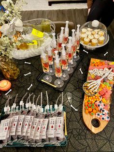 a table topped with lots of cupcakes and drinks