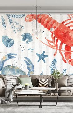 an ocean themed living room with red lobsters on the wall and blue seaweed