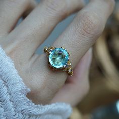 Read about our payment plans before proceeding. Celebrate your special moments with this heavenly Paraiba Tourmaline ring. Handcrafted in your choice of 14K and 18K gold. Featuring a stunning one of a kind Paraiba Tourmaline set with sparkly natural white diamonds. Its intricate milgrain detailing is reminiscent of delicate lace, creating a romantic look that's sure to make a statement. Crafted by skilled hands, this ring is available in your choice of 14K and 18K yellow gold, rose gold, and white gold. Only one available. All orders come in our Tippy Taste ring box. This ring is handmade and designed in NYC. 14K or 18K solid gold Natural Paraiba Tourmaline, Approx. 3.3ct Natural round white diamonds. Approx. 0.62ct carat weight 2mm band thickness ** Tippy Taste Heirloom Collection is made Blue Tourmaline Ring, Tourmaline Rings, Paraiba Tourmaline Ring, Pretty Accessories, Mermaid Jewelry, Paraiba Tourmaline, Sparkly Things, Blue Tourmaline, Tourmaline Ring