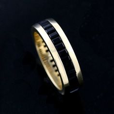 Onyx Men's Ring Eternity Channel Baguettes Onyx Men's Wedding Band 6mm Wide Yellow Gold Gemstone Men's Black Stone This unique men's wedding band is made of 14k yellow gold. There are baguettes onyx (approx. 2.5ct), securely channel set all around. Ring is 6mm wide and 2.2mm tall. PROUDLY MADE FROM SCRATCH IN NEW YORK CITY. Please allow 2-3 weeks to complete the order. SKU: B3091VEN Our Pledge: 1. All items to be BRAND NEW and authentic. 2. All gemstones to be 100% genuine and mined from the ear Classic Black Baguette Cut Rings, Formal Black Baguette Cut Rings, Black Baguette Cut Ring For Formal Occasions, Elegant Black Wedding Bands, Elegant Black Bands For Anniversary, Elegant Black Anniversary Bands, Black Channel Set Rings For Anniversary, Anniversary Black Channel Set Rings, Elegant Black Bands For Gifts