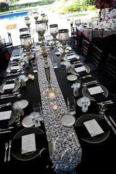 the table is set with silverware and place settings for an elegant dinner party or special event