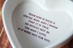 a heart shaped dish with the words your son is such a special man and i know that it is true