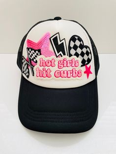 Black and white trendy trucker hat with "hot girls hit curbs" patch, checkered flag, checkered heart, pink sequin star, small pink star and lightning bolt. This cute & funny hat would be sure to get anyone's attention!  This adult size hat was handmade by myself. The hat is made of fabric & foam with mesh along the back. It is easily adjustable in the back & has a ponytail holder. It is comfortable, lightweight & flexible. It fits the average adult size head, measuring about 8" diameter inside t Hat Bar, Black Trucker Hat, Trendy Hat, Funny Hats, Pink Star, Checkered Flag, Adhesive Glue, Ponytail Holder, Pink Stars