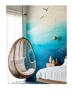 a bedroom with blue and white walls, a hanging chair and a bed in it