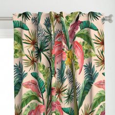 a curtain with tropical leaves and flowers on it